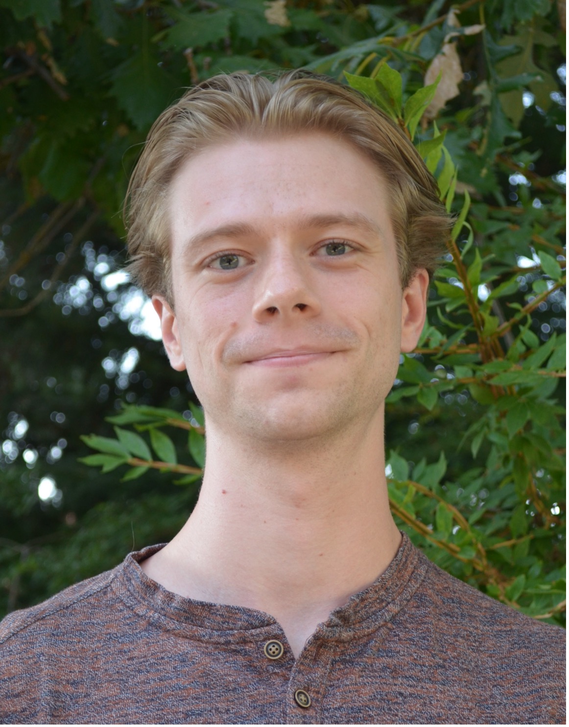 Dishary Banerjee shaking Dean Mary Rezac's hand.