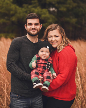 Headshot of Dylan Henderson and his family.