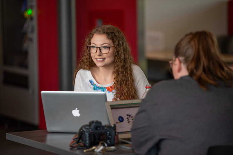 Students relax and study in the Student Union Building on the Tri-Cities campus of Washington State University.