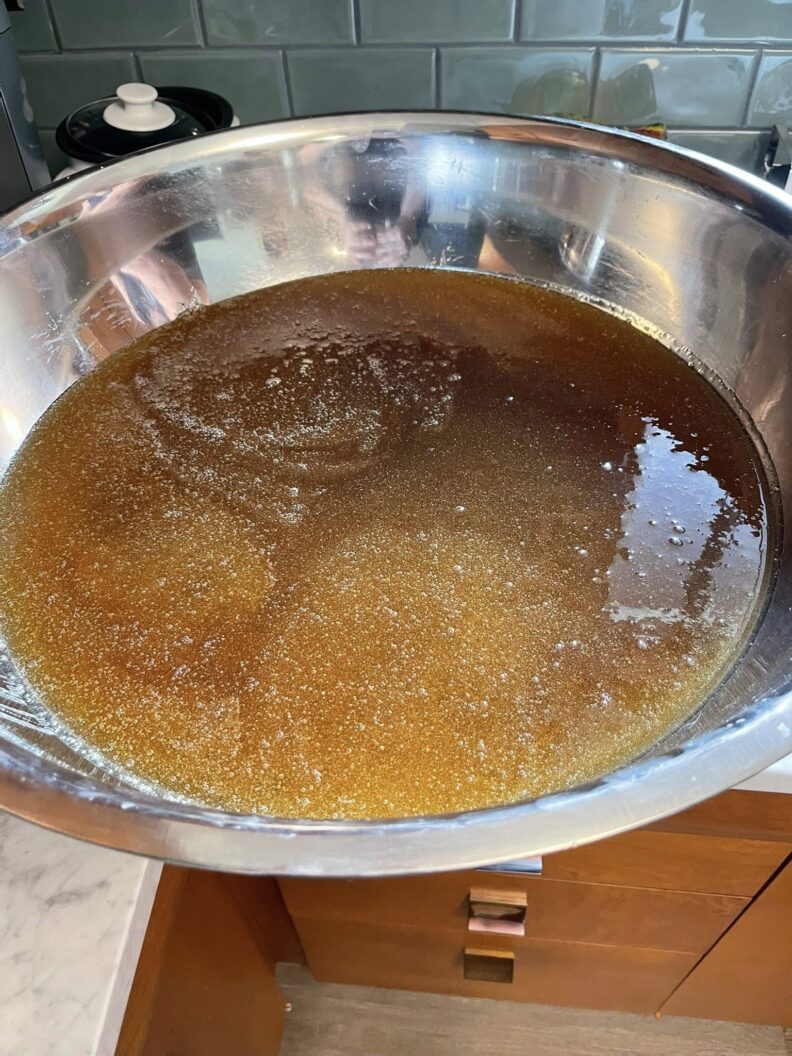 A large bowl full of fresh bee honey. 