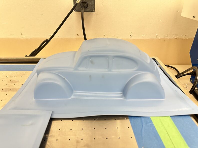 Image of a vacuum formed project shaped like a VW Beetle