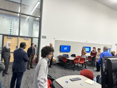 Presentation of research posters by students to personnel from Griffiss Institute, Air Force Research Laboratory, and Department of Defense