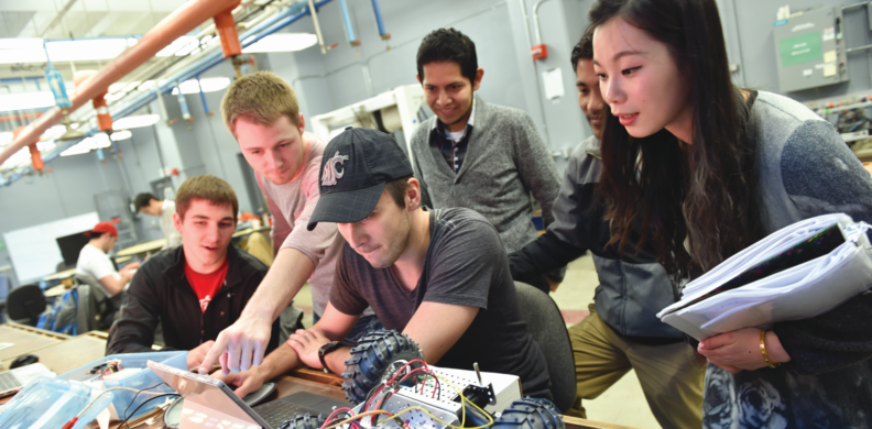 students working on robotic car