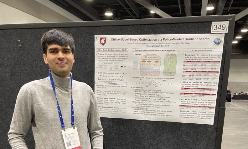 Man standing by a research poster.