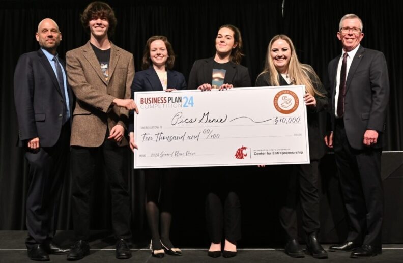PicsGenie team holding an oversized check for $10,000.