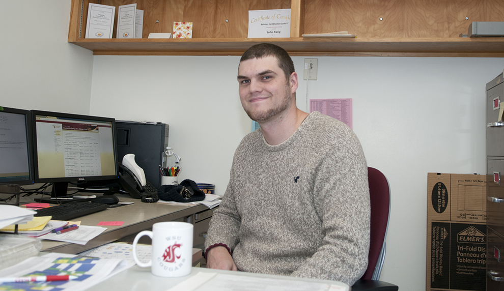 Person sitting in at a desk.