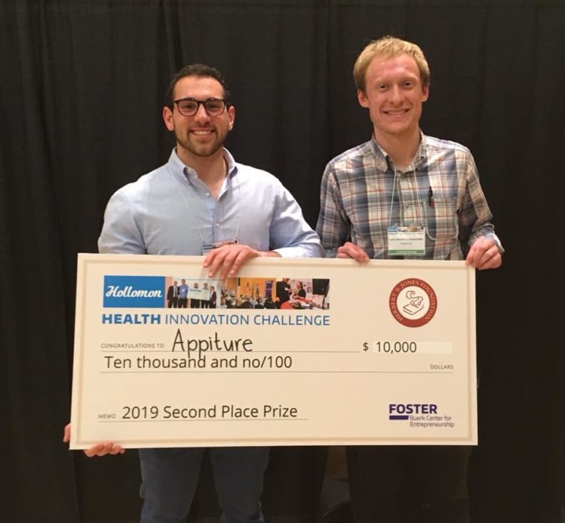 Lars Neuenschwander and TJ Goble with $10,000 check.