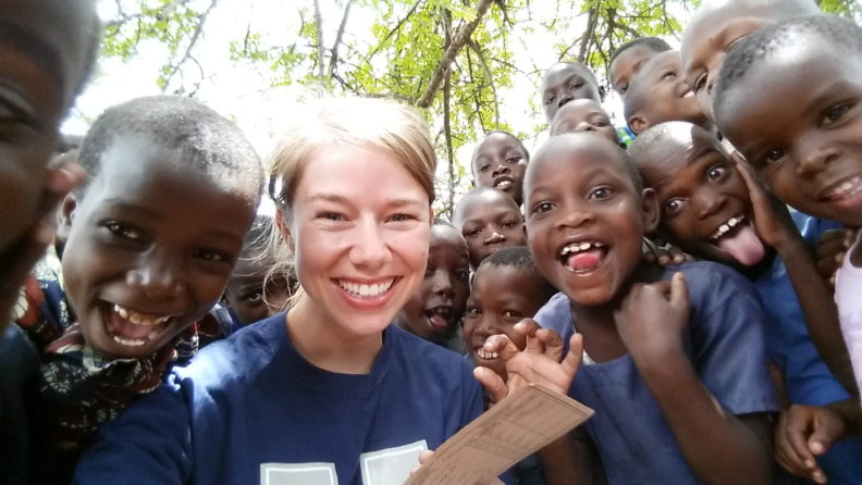 Veterinary student Cassie Eakins with Tanzanian children