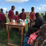 East African children lined up to receive deworming medication