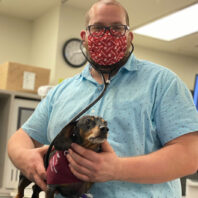 Landon Brough with a small dog