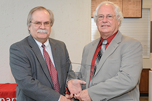 Dr. Franklin receiving award from Dean Slinker.