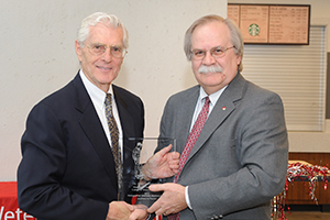 Dr. Seawright receiving award from Dean Slinker.