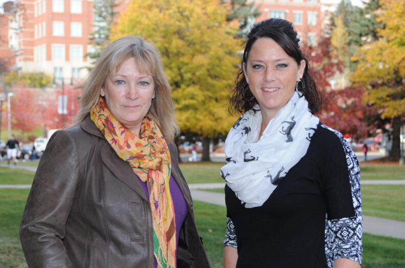 Dale Moore and Rachel Jensen on the law outside the college.