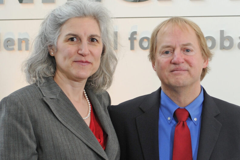 Drs. Beth Fritzler and Tim Kraabel standing in the Allen School lobby.