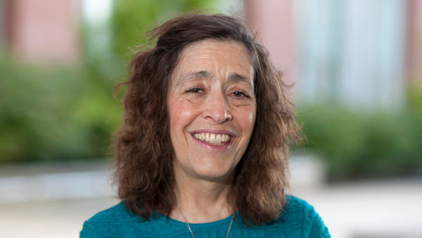 Dr. Mary Sánchez-Lanier standing outside the building she works in.