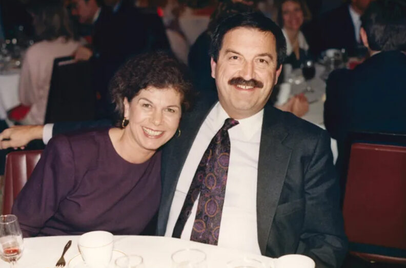 Jan and Jack at a dinner event. They are leaning together for the photo.