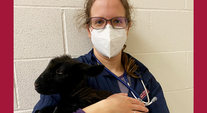 Audrey Spaeth holding a black lamb.