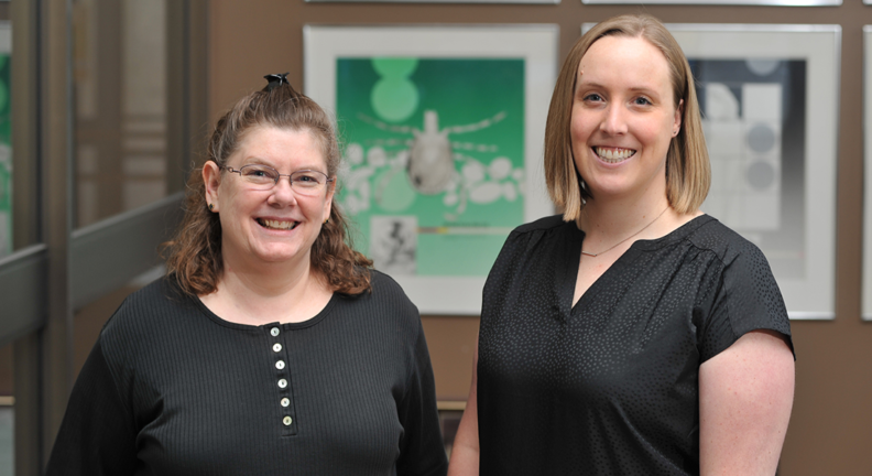 Kelly Brayton and Dana Shaw in the Bustad Hall lobby.