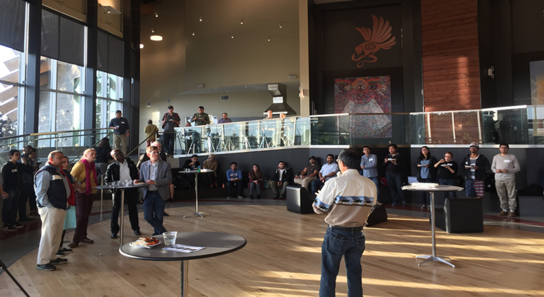 Raymond Sun, a history professor who served as the president of the regional chapter of the Fulbright Association, addressing attendees during a social mixer in 2019.