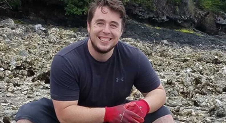 Coty Jasper on a rocky beach.