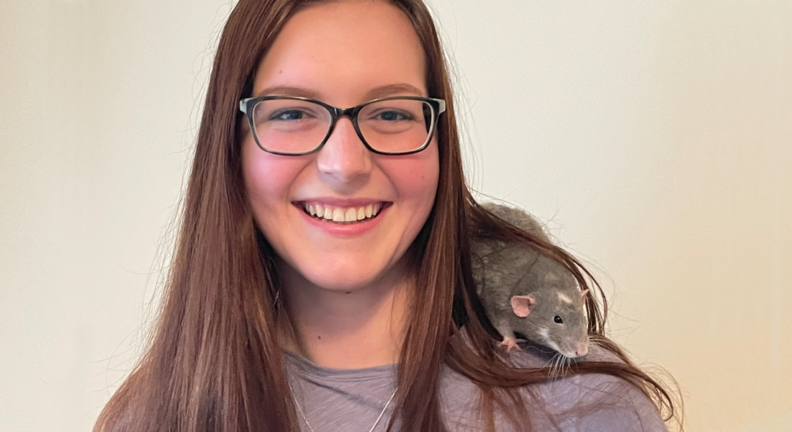 Taylor Waldron with a rat sitting on her shoulder.