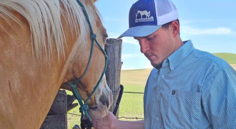 Sheldon with a Palomino horse.