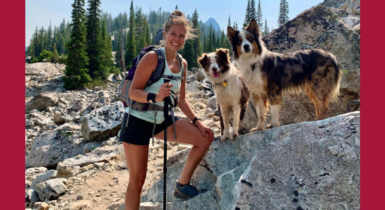 Kayln Wees hiking with her two Australian shepherds.
