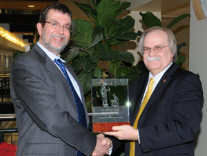 Dr. Glenn H. Cantor receiving award with College of Veterinary Medicine Dean Bryan Slinker.
