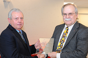 Dr. Gary L. Cook receiving award with College of Veterinary Medicine Dean Bryan Slinker.