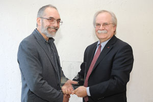 Dr. Michael Garner receiving award with College of Veterinary Medicine Dean Bryan Slinker.