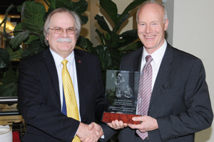 Dr. Steven M. Niemi receiving award with College of Veterinary Medicine Dean Bryan Slinker.