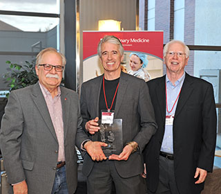 Guy Palmer receiving his award.