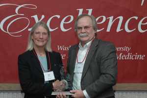 Dr. Susan Stover receiving award with College of Veterinary Medicine Dean Bryan Slinker.