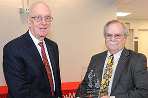 Dr. Robert B. Wilson receiving award with College of Veterinary Medicine Dean Bryan Slinker.