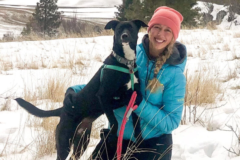 Isla with her dog in the winter.
