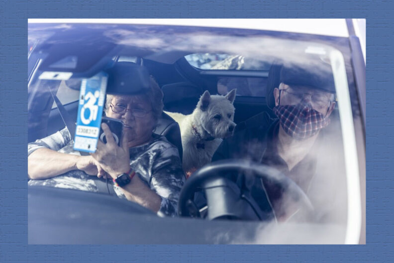Don Robertson and Sue Robertson wait in the car outside Animal Medical Center of Seattle with Duffy, who was there for an oncology appointment.