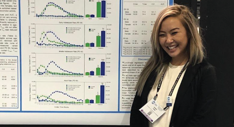 Ginny Park standing in front of her research poster.