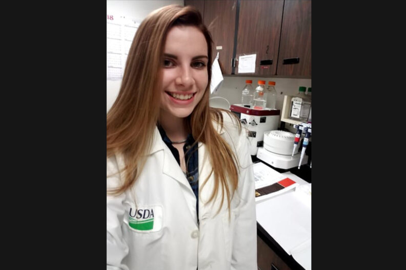 Hayley Masterson standing in a lab.