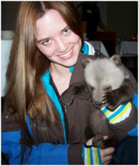 Heather holding a red panda.