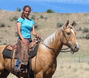 Claire on her palmino horse.