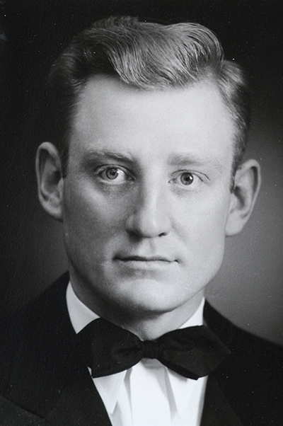 Black and white image of Dr. Berger Keatts in 1950, wearing a black and white suit with a bow tie. 