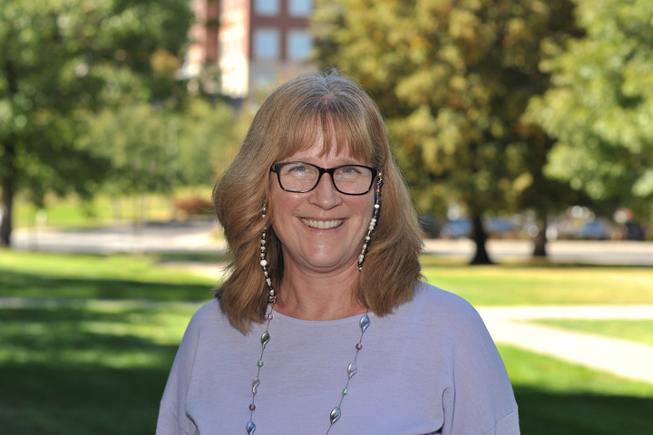 Dean Dori Borjesson standing outside Bustad Hall on the WSU campus.