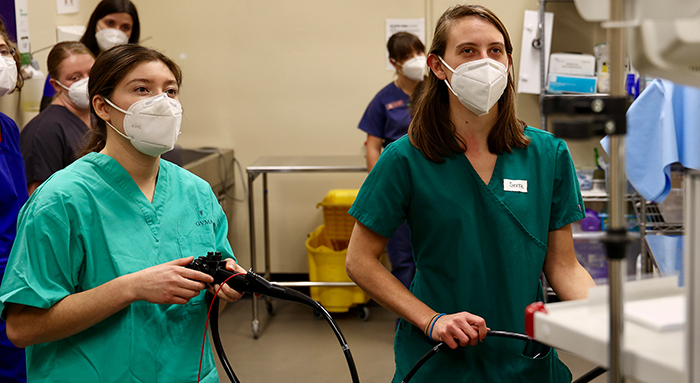 Two students in the midst of a simulated procedure.