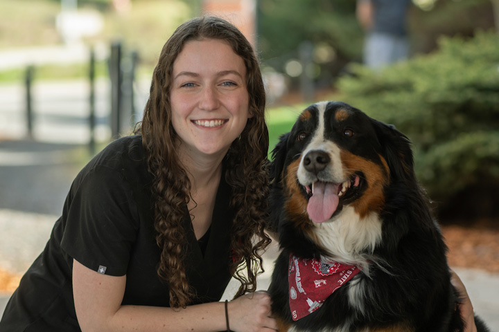 Chloe with Remy, her Burmese Mountain Dog, outside the Teaching Hospital.
