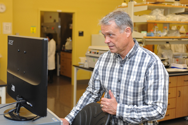 Tom Kawula at a computer.