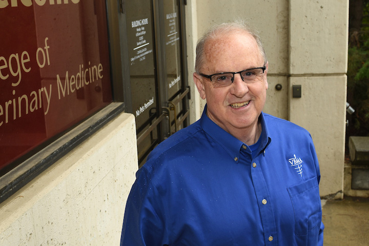 Dr. Richard DeBowes standing in front of one the main entrances to the College of Veterinary Medicine on the WSU Pullman Campus.