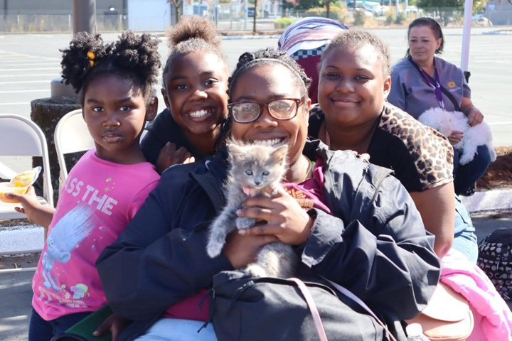 A family receiving care for their kitten.