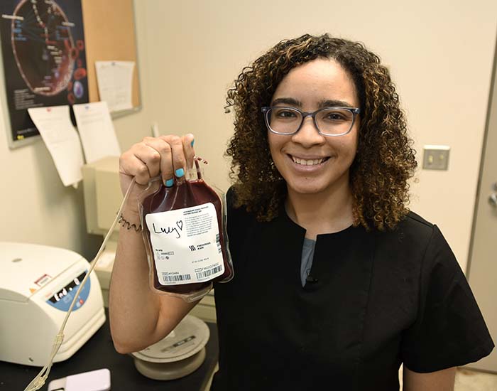 Samantha working in the Veterinary Teaching Hospital Blood Bank.