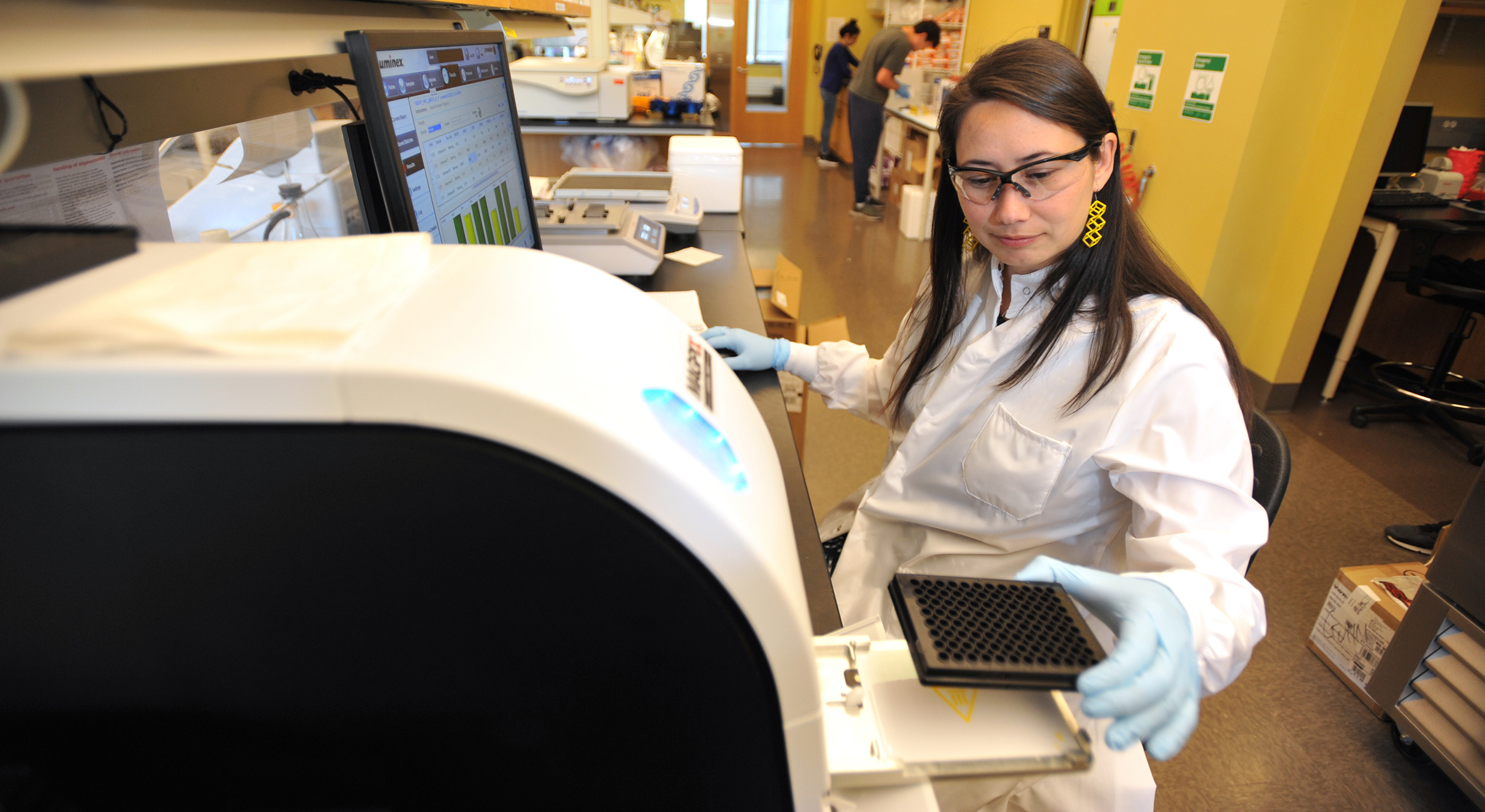 Dr. Bonnie Gunn working in a lab.