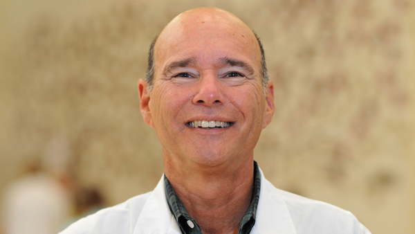 Dr. Martinez outside the College.